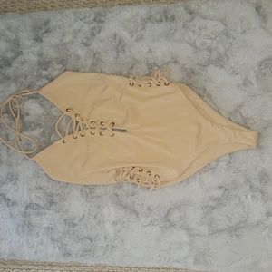 Nude one piece bathing suit